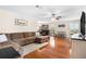 Bright and spacious living room with hardwood floors, large windows, and stylish decor at 5600 Bay Pines Lakes Blvd, St Petersburg, FL 33708