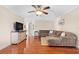 Inviting living room features a ceiling fan and a comfortable sectional sofa at 5600 Bay Pines Lakes Blvd, St Petersburg, FL 33708