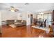 Open-concept living and dining area with hardwood floors and natural light at 5600 Bay Pines Lakes Blvd, St Petersburg, FL 33708