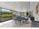 Spacious screened patio with comfortable seating and dining areas at 5600 Bay Pines Lakes Blvd, St Petersburg, FL 33708