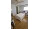 Cozy bedroom features wood floors, and a ceiling fan for comfortable living at 585 Sky Harbor Dr # 327, Clearwater, FL 33759
