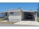 Cozy home with an attached carport providing convenient covered parking at 585 Sky Harbor Dr # 327, Clearwater, FL 33759