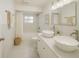 Elegant bathroom featuring double sinks, modern fixtures, and a tub for ultimate comfort and style at 5911 63Rd N Ter, Pinellas Park, FL 33781