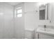 Bathroom features modern tiling in shower, a vanity with a sink, and a toilet at 5911 63Rd N Ter, Pinellas Park, FL 33781