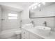 Bright white bathroom with dual vessel sinks, modern fixtures and subway tile at 5911 63Rd N Ter, Pinellas Park, FL 33781