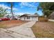 Charming single-story home with a long driveway and attached garage, ready for new owners at 5911 63Rd N Ter, Pinellas Park, FL 33781