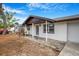 Inviting single-Gathering home featuring a covered porch, offering comfortable outdoor living at 5911 63Rd N Ter, Pinellas Park, FL 33781