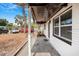 Covered porch with painted brick columns, mature landscaping, and brick border at 5911 63Rd N Ter, Pinellas Park, FL 33781