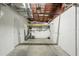 Garage with a sink, water heater, shelving, and multiple doors for convenient access and storage at 5911 63Rd N Ter, Pinellas Park, FL 33781