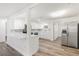 Stylish kitchen featuring modern stainless steel appliances, white countertops and cabinetry at 5911 63Rd N Ter, Pinellas Park, FL 33781