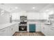Modern kitchen features bright white cabinetry, stainless steel appliances, and stylish countertops at 5911 63Rd N Ter, Pinellas Park, FL 33781