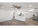 Open-concept living room showcasing a bar and seamlessly connected kitchen area at 5911 63Rd N Ter, Pinellas Park, FL 33781