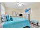 Inviting bedroom with a beachy accent and a light blue quilt, showcasing comfort at 601 N Hercules Ave # 101, Clearwater, FL 33765