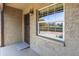 Welcoming front porch featuring a textured exterior, light fixture, and large window at 601 N Hercules Ave # 101, Clearwater, FL 33765