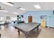 This community game room has ample seating, pool tables, and lots of activities at 601 N Hercules Ave # 101, Clearwater, FL 33765