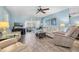Relaxing living area featuring comfortable seating, a TV, and a seamless transition to the lanai at 601 N Hercules Ave # 101, Clearwater, FL 33765