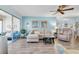 Stylish living room with wood-look floors, comfortable seating, and a view to the lanai at 601 N Hercules Ave # 101, Clearwater, FL 33765