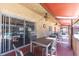 This covered patio provides outdoor seating with multiple tables and access to the pool at 601 N Hercules Ave # 101, Clearwater, FL 33765