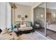 Cozy screened patio featuring wicker furniture, decorative accents, and sliding glass doors at 601 N Hercules Ave # 101, Clearwater, FL 33765
