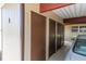 Row of storage units outside the building, with a neutral color scheme at 601 N Hercules Ave # 101, Clearwater, FL 33765