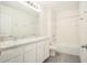 A spacious bathroom featuring double sinks, modern fixtures, and a shower-tub combo at 6967 Silverado Ranch Blvd, Zephyrhills, FL 33541