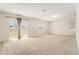 Sun-filled living room with sliding glass doors, plush carpet, and an abundance of natural light at 6967 Silverado Ranch Blvd, Zephyrhills, FL 33541