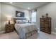 Bedroom featuring neutral tones, a sports theme, and modern rustic furniture at 712 Estates Blvd, Tarpon Springs, FL 34689