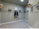 Walk-in closet with carpeted floors, shelving, and rod for hanging clothes at 712 Estates Blvd, Tarpon Springs, FL 34689