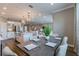 Open-concept dining room offers elegant decor and convenient access to the adjacent kitchen and living area at 712 Estates Blvd, Tarpon Springs, FL 34689