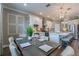 Stylish dining room featuring a modern table setting and an open view of the adjacent gourmet kitchen at 712 Estates Blvd, Tarpon Springs, FL 34689