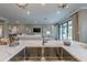 Well-designed kitchen with quartz countertops, stainless steel sink, and a clear view into the spacious living area at 712 Estates Blvd, Tarpon Springs, FL 34689