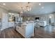 Bright, open kitchen with a large island, stainless steel appliances, and seamless flow to the living area at 712 Estates Blvd, Tarpon Springs, FL 34689