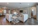 Bright, open-concept living room with views of the dining room and modern furnishings at 712 Estates Blvd, Tarpon Springs, FL 34689