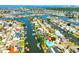 Great aerial view of waterfront homes on canals, offering direct access to boating and water activities at 732 Kingston Ct, Apollo Beach, FL 33572