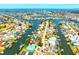 Beautiful aerial view of a waterfront community with canals and a blue house, perfect for boating enthusiasts at 732 Kingston Ct, Apollo Beach, FL 33572