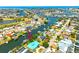 Stunning aerial view of a waterfront property with private dock and boat, nestled within a picturesque community at 732 Kingston Ct, Apollo Beach, FL 33572