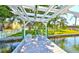 Tranquil backyard with private dock and boat access, perfect for enjoying waterfront living and outdoor recreation at 732 Kingston Ct, Apollo Beach, FL 33572