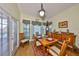 Dining room with classic furniture, a vintage decor and lots of natural light at 732 Kingston Ct, Apollo Beach, FL 33572
