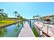 A well-maintained wooden dock is the perfect spot for boating and enjoying waterfront living, with boat docked at 732 Kingston Ct, Apollo Beach, FL 33572