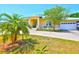 Inviting home exterior with a covered porch, manicured landscaping, and an attached garage, exuding curb appeal at 732 Kingston Ct, Apollo Beach, FL 33572