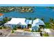 Stunning waterfront restaurant exterior featuring ample parking and outdoor dining area with beautiful bay views at 732 Kingston Ct, Apollo Beach, FL 33572