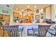 Open kitchen with stainless steel appliances, wood cabinets, and bar seating at 732 Kingston Ct, Apollo Beach, FL 33572
