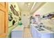 Spacious laundry room equipped with a washer, dryer, ample counter space, and quirky decorations at 732 Kingston Ct, Apollo Beach, FL 33572