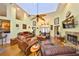 Expansive living room with high ceilings, skylights, a fireplace, hardwood floors, and ample seating space at 732 Kingston Ct, Apollo Beach, FL 33572