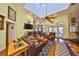 Inviting living room with hardwood floors, high ceilings, skylights, fireplace, and cozy leather furniture at 732 Kingston Ct, Apollo Beach, FL 33572