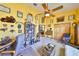 The home office is bright and open, with ample space for dual desks and a small couch at 732 Kingston Ct, Apollo Beach, FL 33572