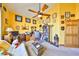 This home office features a vaulted ceiling, a ceiling fan, and plenty of wall decor at 732 Kingston Ct, Apollo Beach, FL 33572