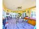 Large sun room featuring a jacuzzi, lounge seating, dining and water views at 732 Kingston Ct, Apollo Beach, FL 33572