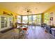 Bright sun room with a jacuzzi, outdoor dining, and scenic water views at 732 Kingston Ct, Apollo Beach, FL 33572