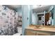 Cozy bathroom featuring a marble sink, vanity, toilet and shower with curtain at 7321 Central Ave # 503, St Petersburg, FL 33710